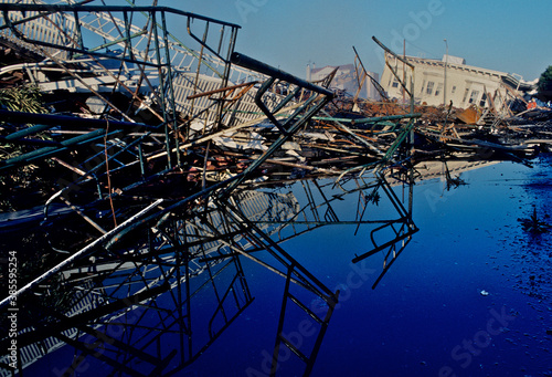 Photography Water pooled and reflecting collapsed buildings from evening firefight in Marina District, San Francisco, California after the Loma Prieta 1989 Earthquake