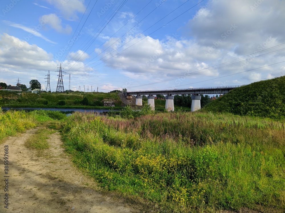 summer landscape of the river flow under the bridge in the summer summer landscape of the river flow under the bridge in the summer