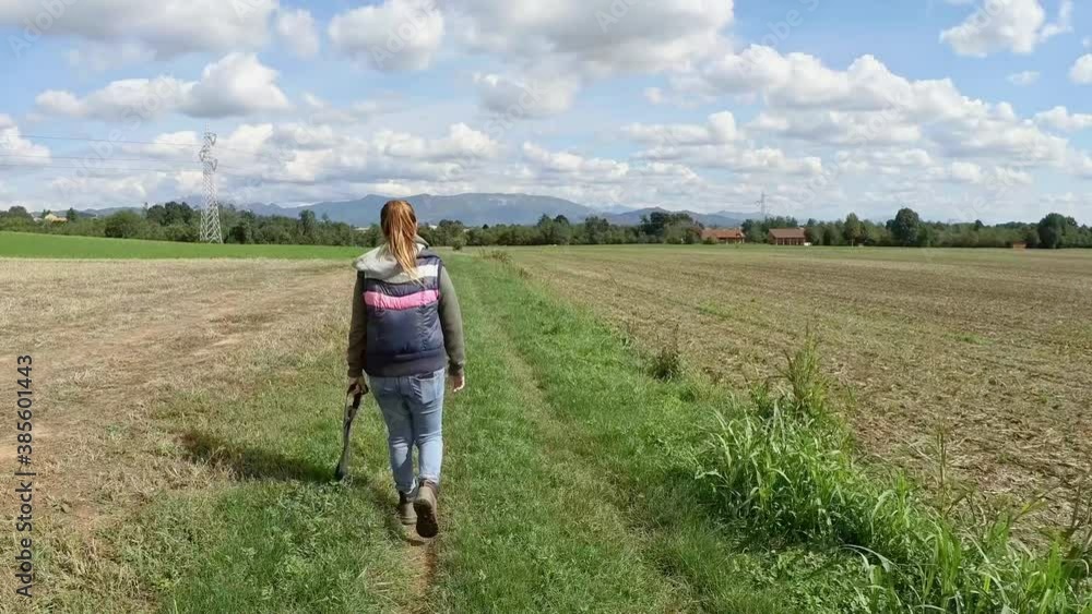Woman Walking in the Field at Italy Countryside Woman Walking in the Field at Italy Countryside