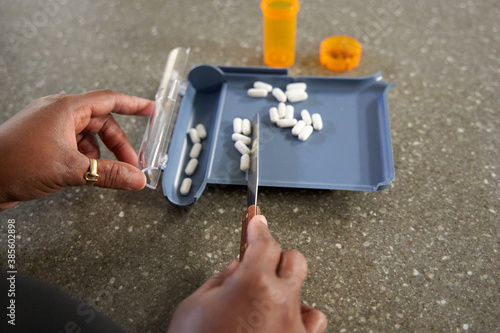 Black pharmacist prepare medication for hospital patient photo