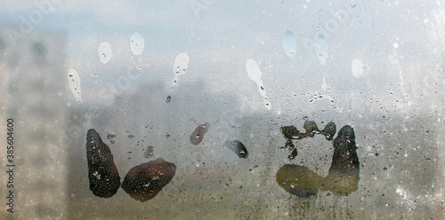 Photography A child's handprint on the fogged glass