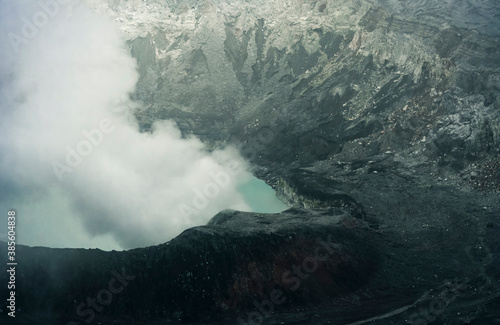 Crater Lake with smoke in Poas Volcano National Park