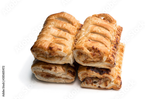 Cheese and bacon sausage rolls isolated on white