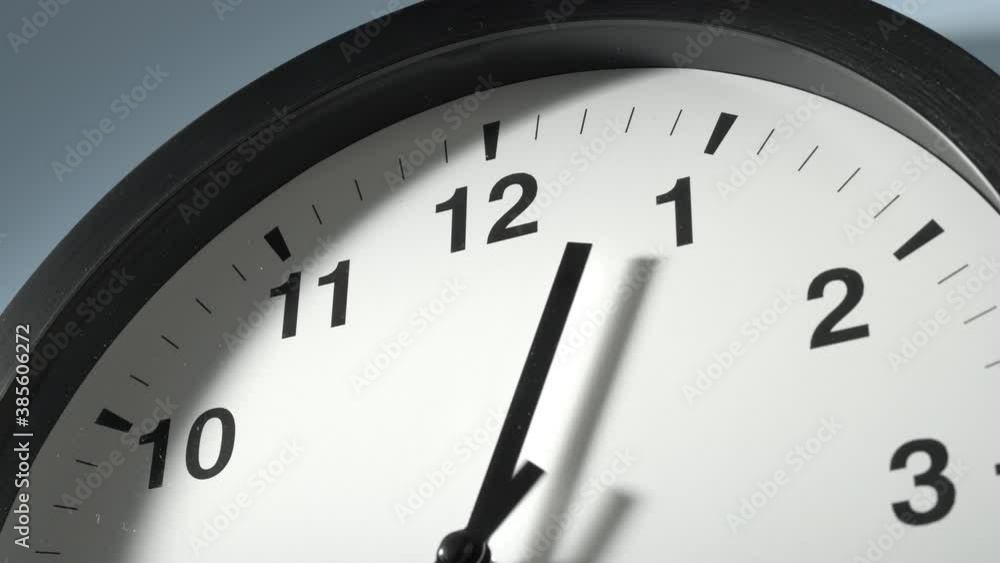 Clock Face in Time Lapse on Light Sky Blue Wall in Office Clock Face in Time Lapse on Light Sky Blue Wall in Office