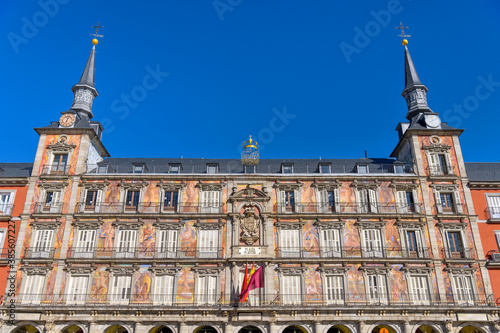Plaza Mayor - A wide-angle and low-angle view of one of surrounding buildings of Plaza Mayor on a sunny Autumn day. Madrid, Spain.