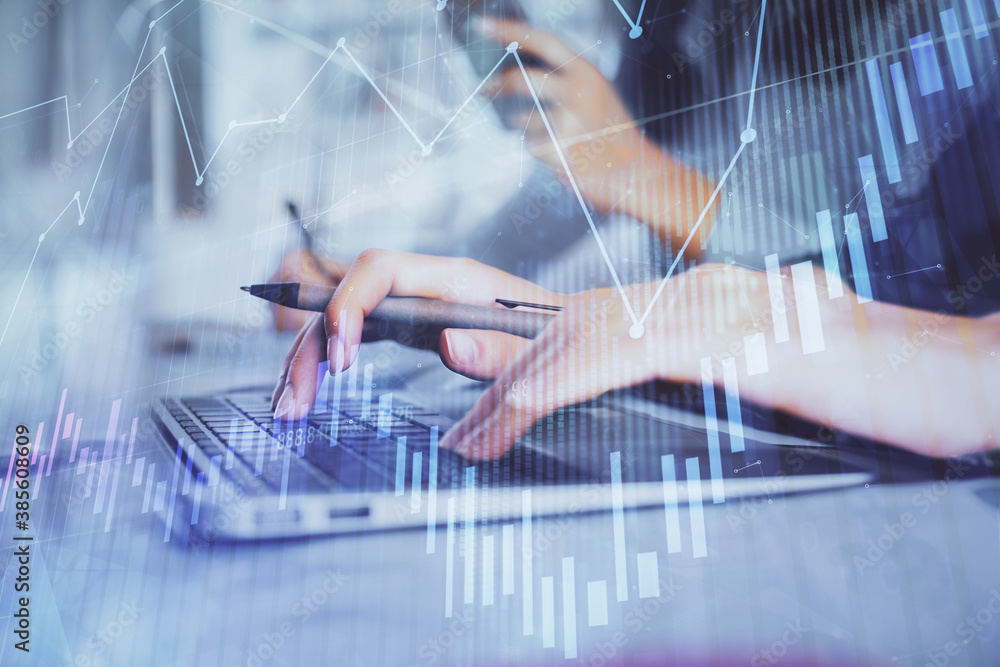 Multi exposure of woman hands typing on computer and financial graph hologram drawing. Stock market analysis concept.
