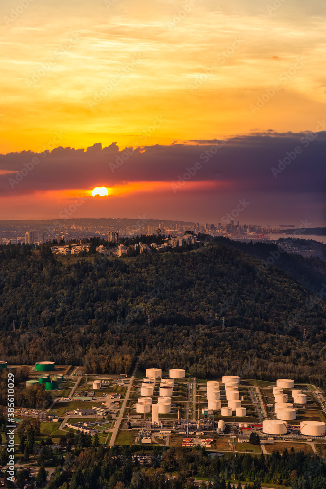 Aerial view of Burnaby Mountain during a vibrant morning. Beautiful sunset sky Artistic Render. Taken in Greater Vancouver, British Columbia, Canada. Modern City viewed from Above.