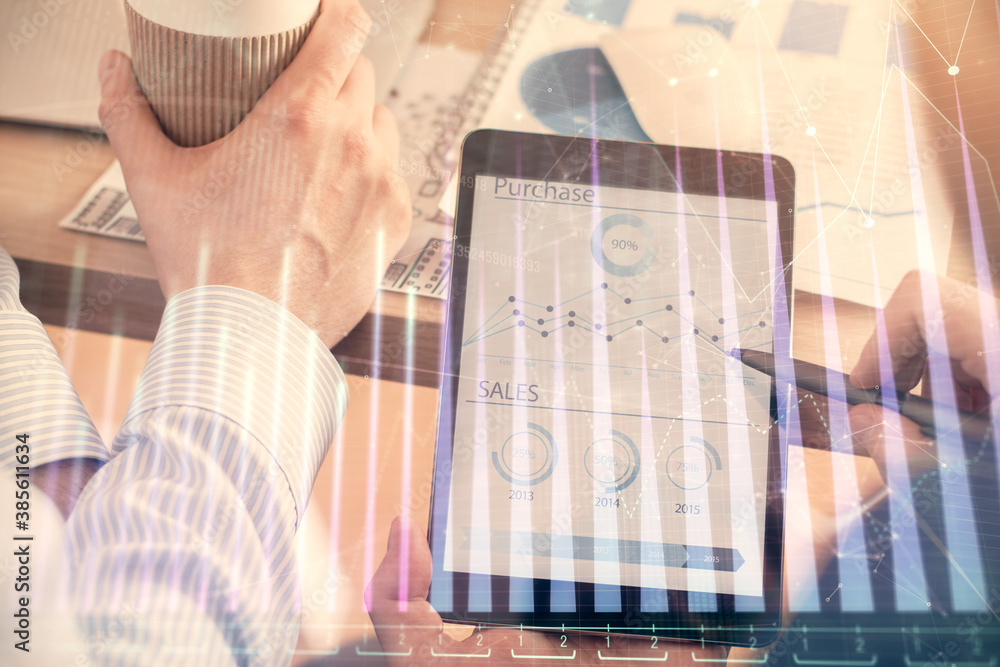 Double exposure of man's hands holding and using a phone and financial chart drawing. Market analysis concept. Double exposure of man's hands holding and using a phone and financial chart drawing. Market analysis concept.