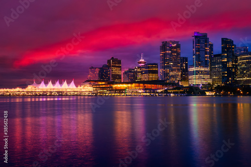 View of Coal Harbour in Downtown Vancouver  British Columbia  Canada  after Sunset. Modern City Skyline during Night. Dramatic Sky Artistic Render