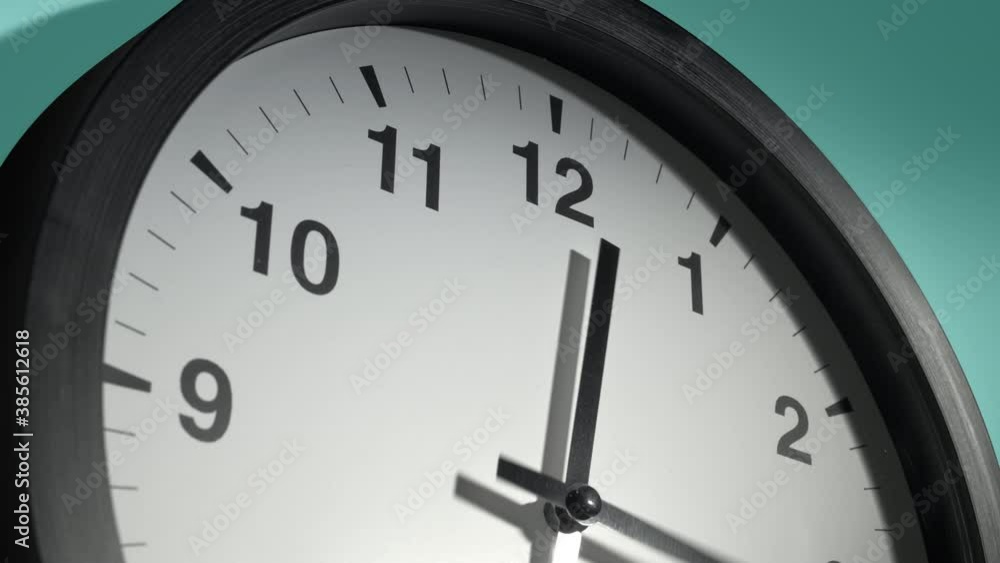 Clock Face in Time Lapse on Cyan Aquamarine Celadon Sea-Green Wall in Office Clock Face in Time Lapse on Cyan Aquamarine Celadon Sea-Green Wall in Office