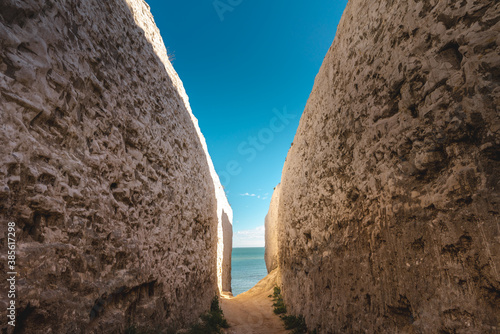 Empty Kingsgate Beach, walking through the chalk stacks clifs at Botany Bay in Kent, England. photo