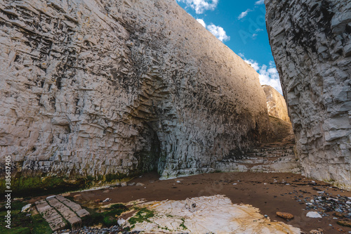 Empty Kingsgate Beach, walking through the chalk stacks clifs at Botany Bay in Kent, England. photo