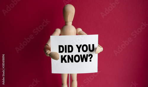 Wallpaper Mural The wooden man holds a white sign with the text DID YOU KNOW in his hands. The content of the lettering has implications for business concept and marketing. Torontodigital.ca