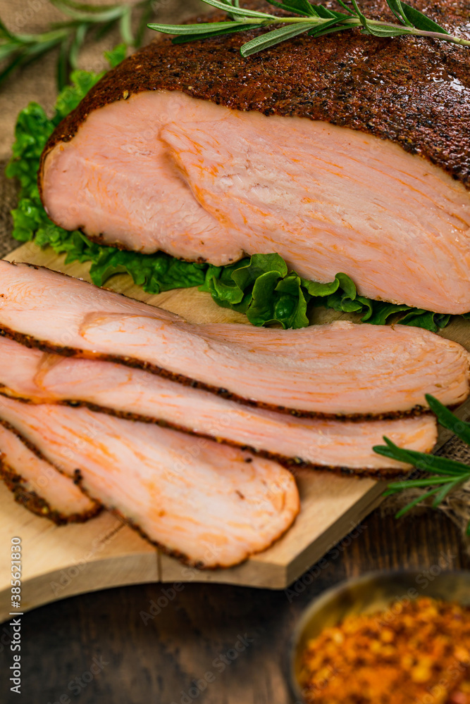 Roasted Turkey Breast Cajun Style Deli Lunch Meat on Old Wooden Background. Selective focus. Roasted Turkey Breast Cajun Style Deli Lunch Meat on Old Wooden Background. Selective focus.