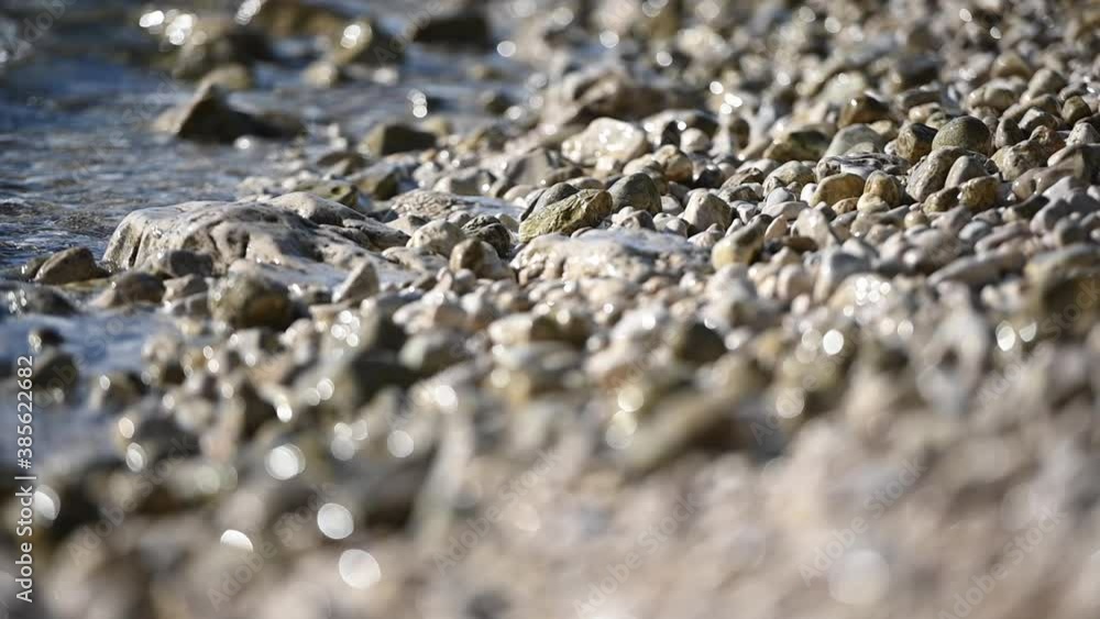 Ocean Water Washing Pebble Beach Rocks in Slow Motion Close Up Footage Ocean Water Washing Pebble Beach Rocks in Slow Motion Close Up Footage
