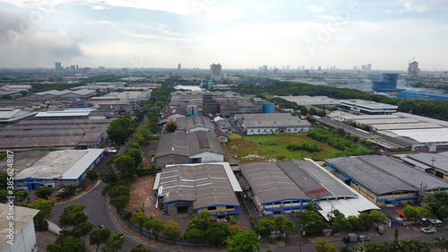 Aerial view of the industrial complex area of Surabaya Industrial Estate Rungkut (SIER) Surabaya, Indonesia, in the middle of a densely populated residential area in the Rungkut area, Surabaya City photo