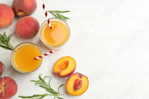 Natural freshly made peach juice on white table  flat lay. Space for text
