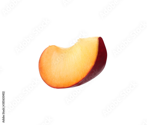 Slice of ripe plum isolated on white