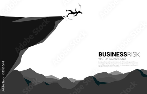 silhouette of businesswoman slip and falling down from the cliff. Concept for fail and accidental business