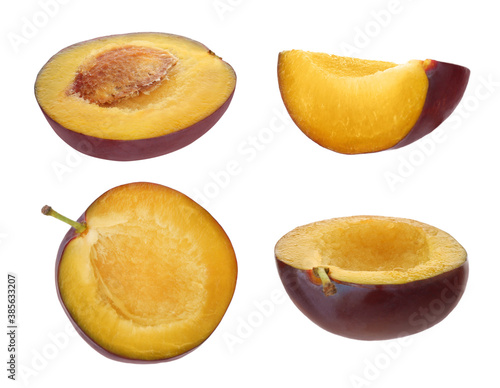 Set of cut fresh plums on white background