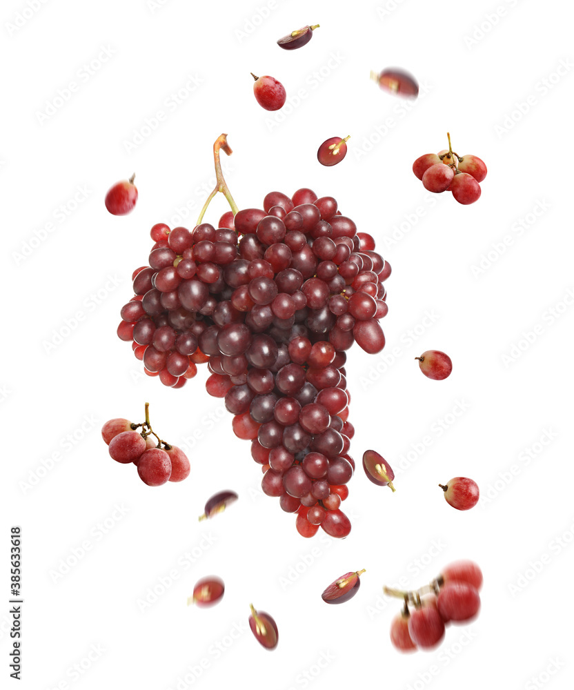 Fresh ripe grapes falling on white background Fresh ripe grapes falling on white background