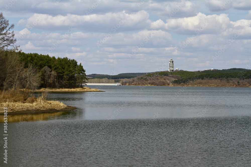 Lake in the spring with a tower by the lake fall
