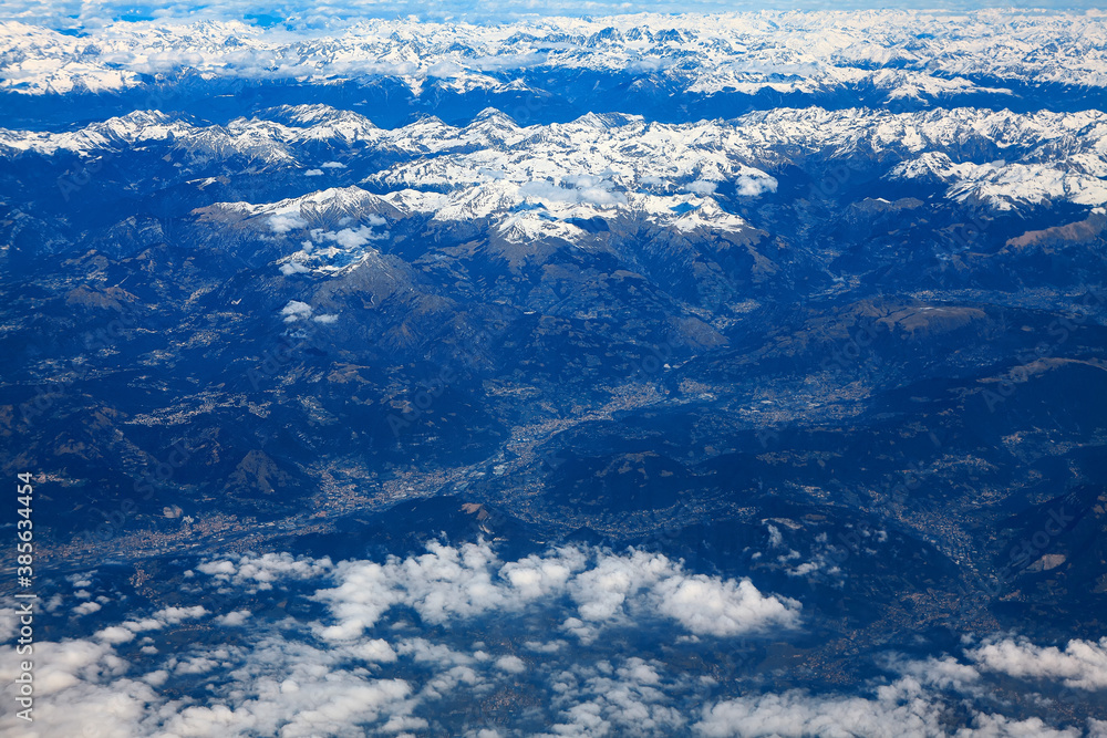 Clouds and snowy mountains peaks 
