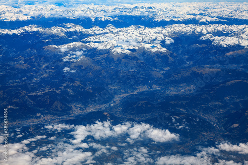 Clouds and snowy mountains peaks 