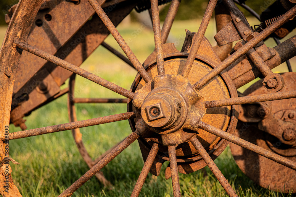 Old Rusted Plow Wheel On Grass