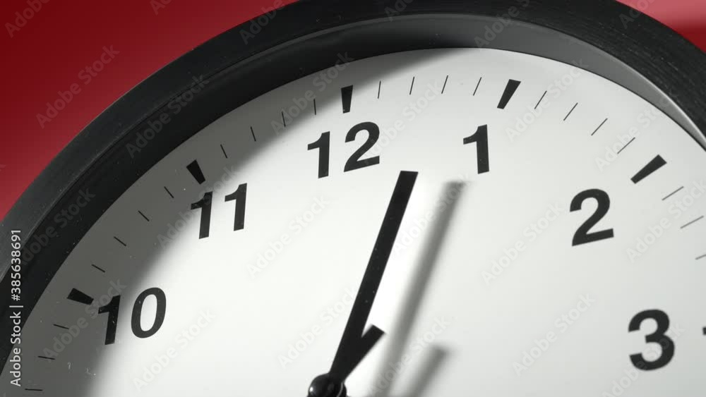 Clock Face in Time Lapse on Red Burgundy Cherry Wall in Office Clock Face in Time Lapse on Red Burgundy Cherry Wall in Office