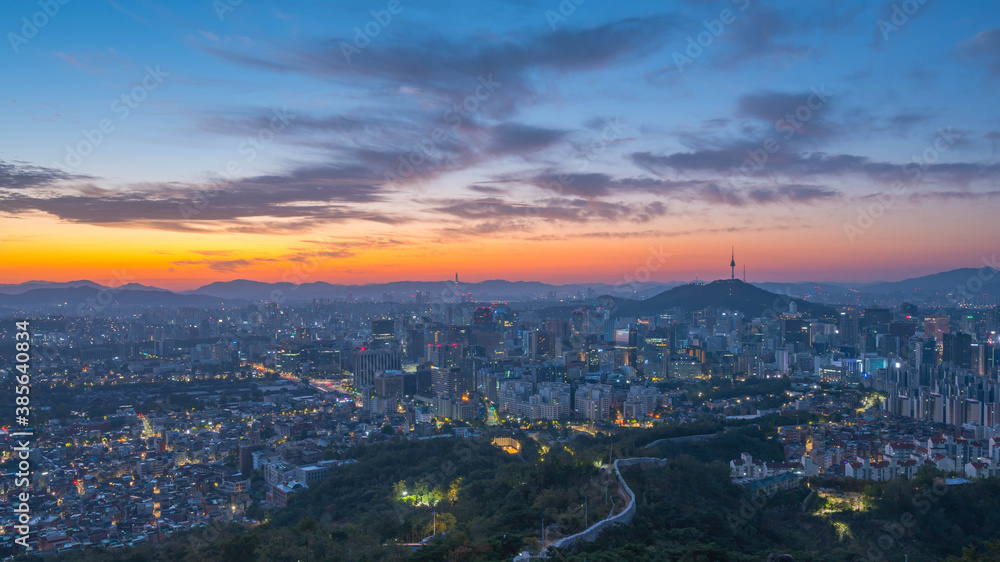  morning Seoul city skyline and Seoul tower modern building and architecture, Beautiful clouds flow through during   sunrise,seen from inwang san The best view of Seoul South,Korea.