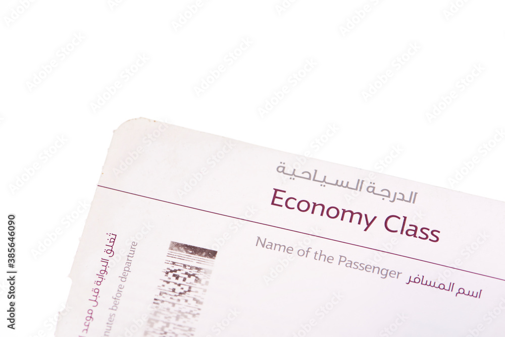 Close up of economy class boarding pass English and Arabic langauge with empty space Close up of economy class boarding pass English and Arabic langauge with empty space