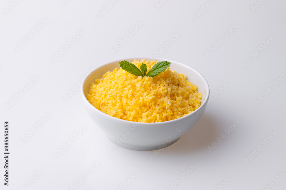 Brazilian Northeast Couscous (Cuscuz Nordestino). Maize couscous on white background Brazilian Northeast Couscous (Cuscuz Nordestino). Maize couscous on white background