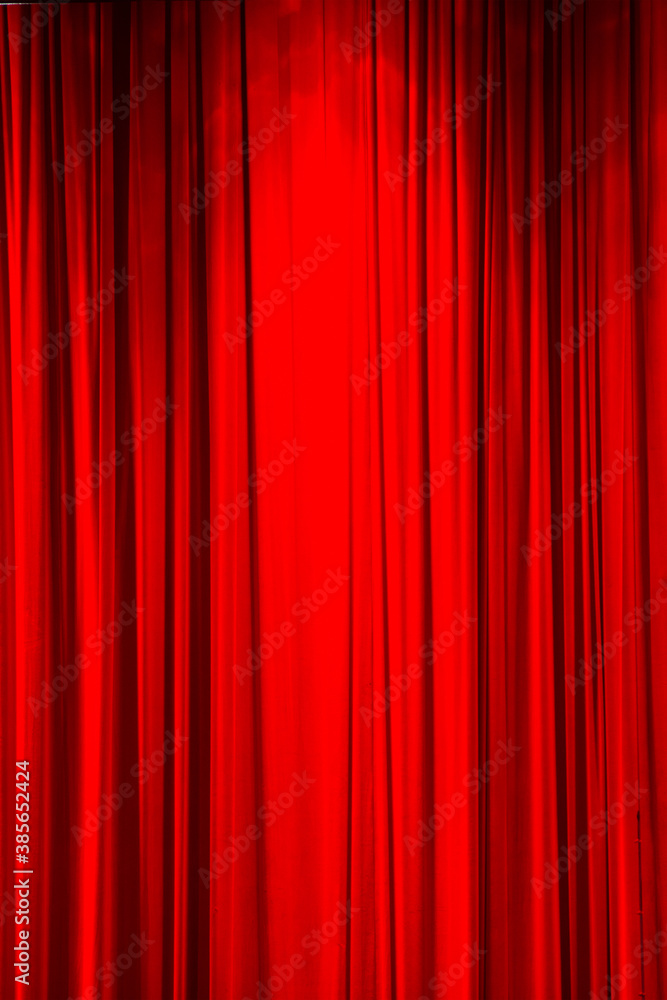 Red curtain background or backdrop copy-space, with folds and creases.