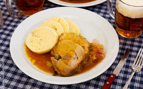 Traditional old Bohemian dumplings served with sauerkraut and baked pork. Dish of Czech cuisine © JackF