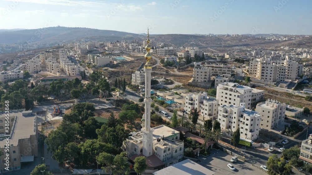 Golden Mosque Tower Minaret in Beit Hanina, Aerial view
Palestinian Muslim Mosque Masjed aldaoa, Drone image
