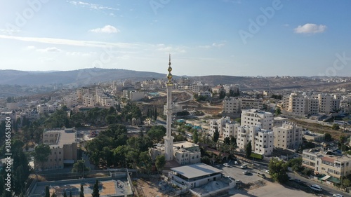 Golden Mosque Tower Minaret in Beit Hanina, Aerial view Palestinian Muslim Mosque Masjed aldaoa, Drone image  © ImageBank4U