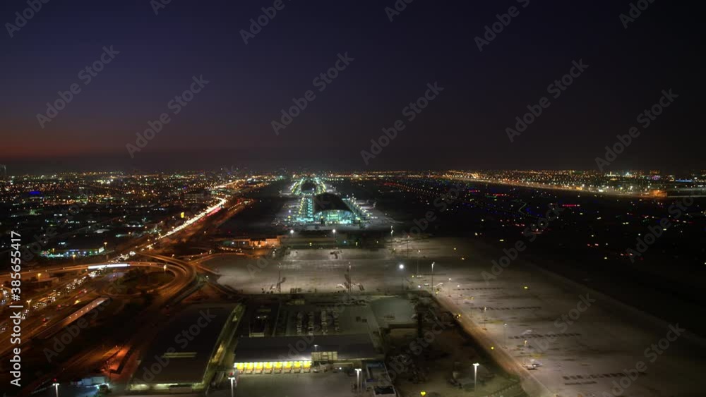 An amazing aerial view of Dubai airport night view. wide-angle parallax ...
