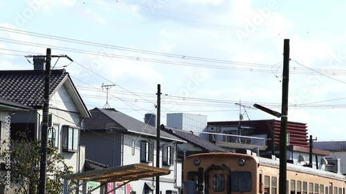 Railroad departing from the station in front of the house photo