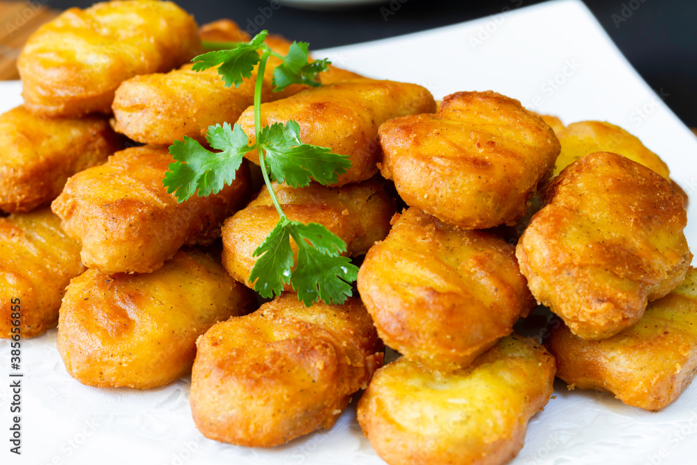 Asian style battered and deep fried chicken nugget in sauce Asian style battered and deep fried chicken nugget in sauce
