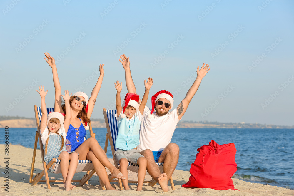 Happy family celebrating Christmas at tropical resort