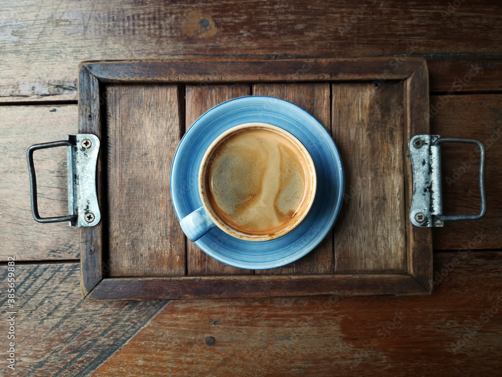 a cup of latte art coffee on wooden background a cup of latte art coffee on wooden background