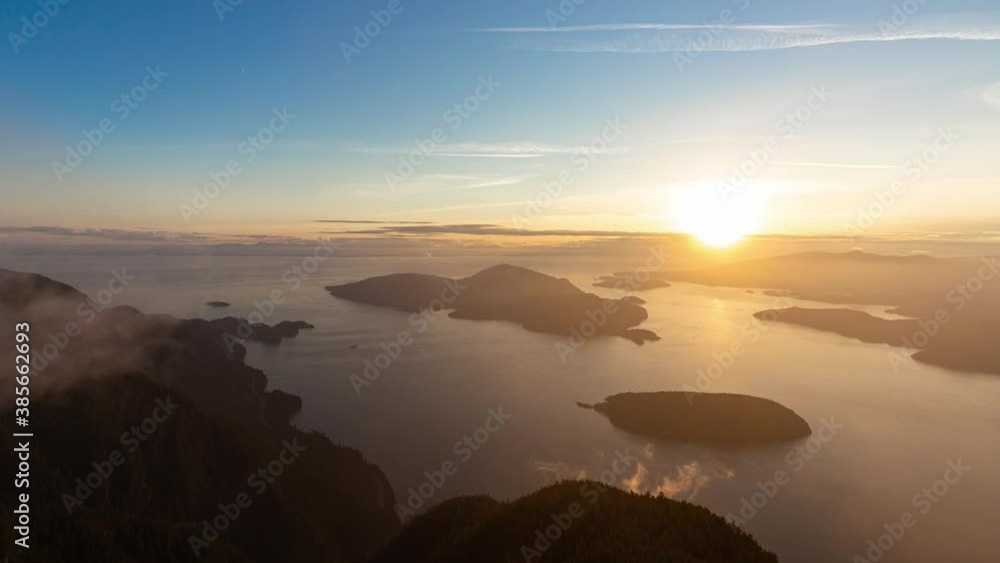 Timelapse. Beautiful View of Canadian Mountain Landscape during a colorful sunny sunset. Taken on St. Mark's Summit, West Vancouver, British Columbia, Canada. Nature Background Timelapse. Beautiful View of Canadian Mountain Landscape during a colorful sunny sunset. Taken on St. Mark's Summit, West Vancouver, British Columbia, Canada. Nature Background