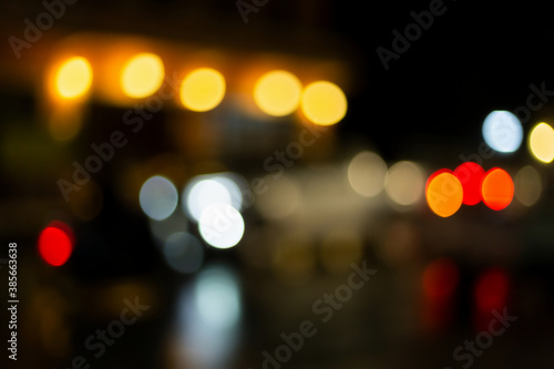 Christmas and Happy new year on blurred bokeh lights on black background. © Keopaserth
