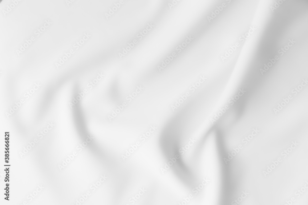 Blurred white abstract wavy clothes background.
