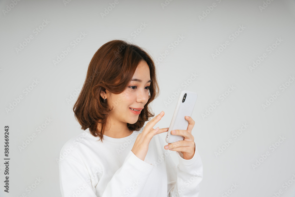 Asian woman with smartphone isolate on white background. Asian woman with smartphone isolate on white background.