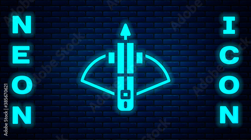 Glowing neon Battle crossbow with arrow icon isolated on brick wall background. Vector.