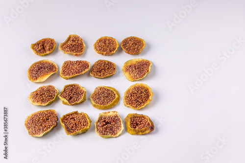 slices of dried figs on a white background. dried fruits. eco. top view.