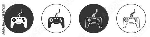 Black Gamepad icon isolated on white background. Game controller. Circle button. Vector.