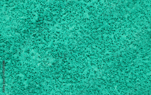 Porous green sponge close-up. Abstraction.
